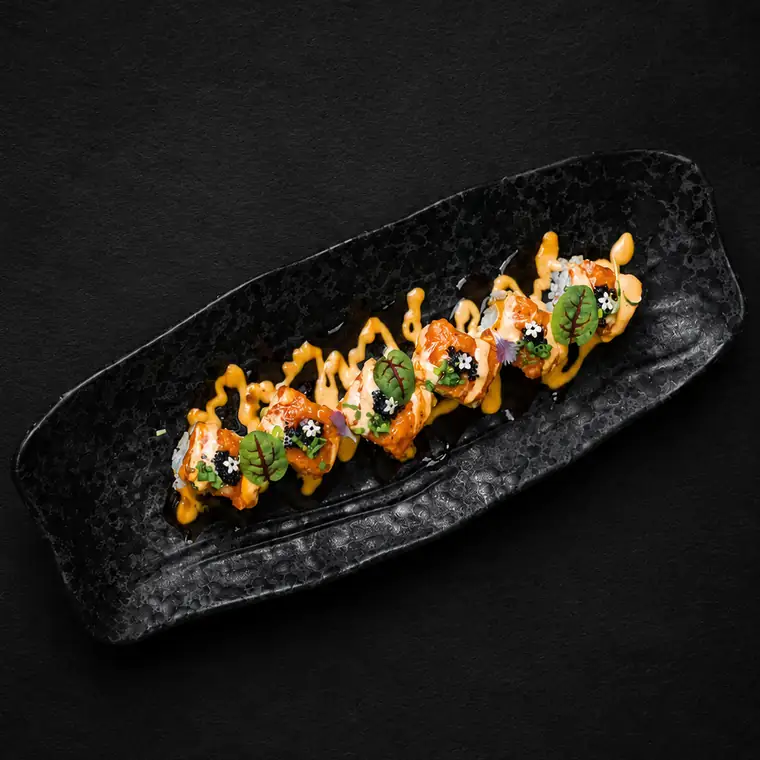 Salmon Empire Roll — Salmon Aburi, Tamago, Avocado Wrapped with Chopped Spicy Salmon, Topped with Eel Sauce, Chilli Mayonnaise & Black Tobiko. ENSO Japanese Fusion & Bar, Canggu, Bali.