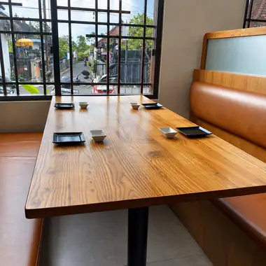 A table by the lattice window - ENSO Japanese Fusion & Bar, Jl. Tanah Barak No.19, Canggu, Bali
